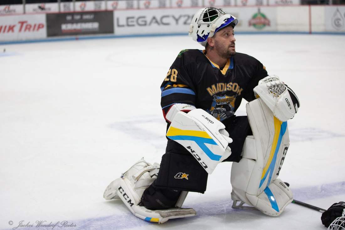 Warriors goalie #28 down in the crease